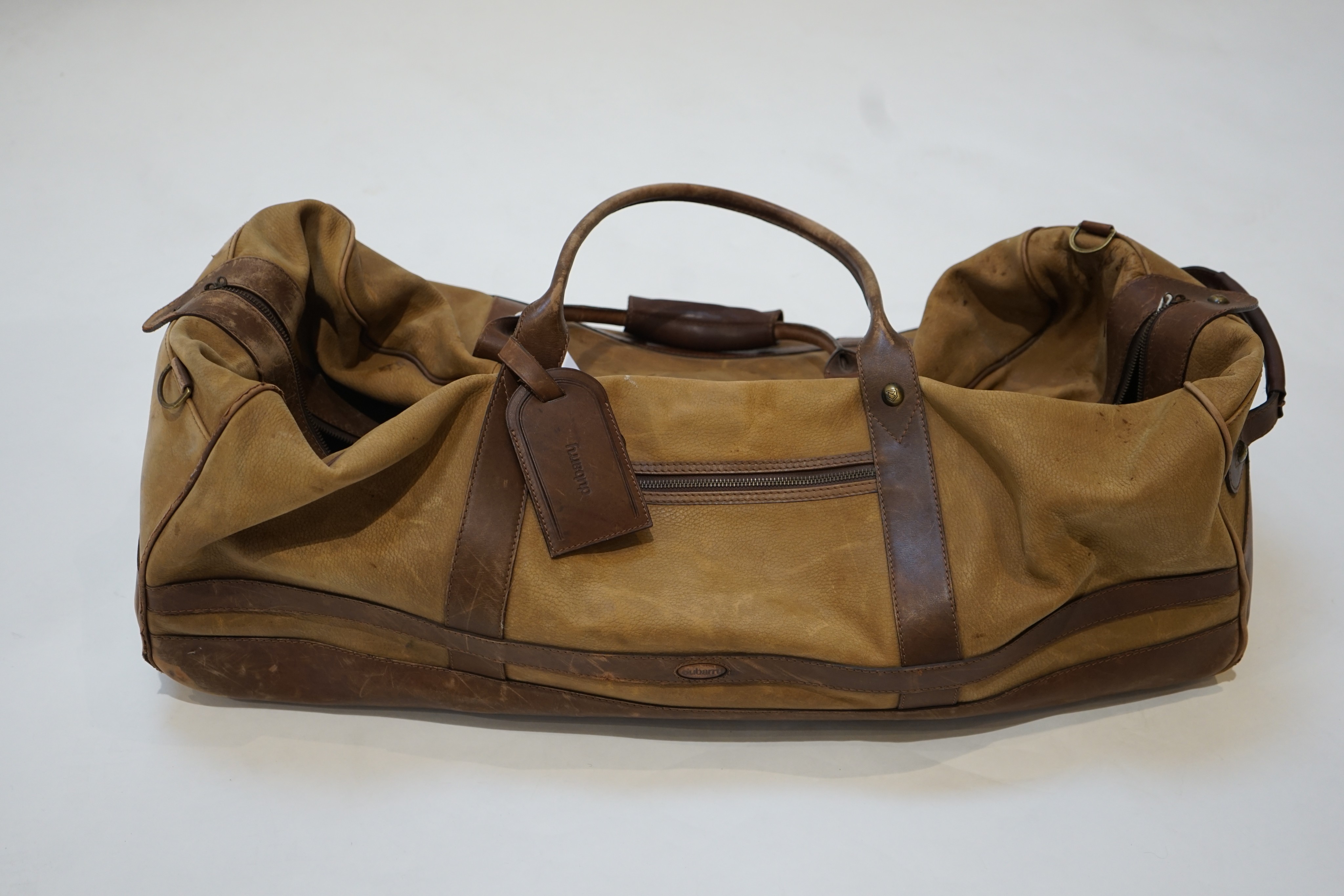 A large Dubarry leather travel bag and two pairs of gentleman's Dubarry brown leather boots, size 8.5/9